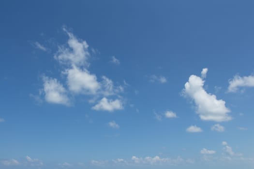 White clouds in the blue sky.