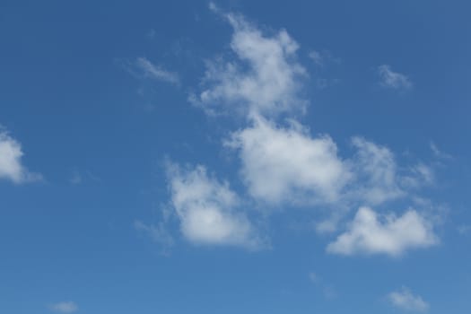 White clouds in the blue sky.