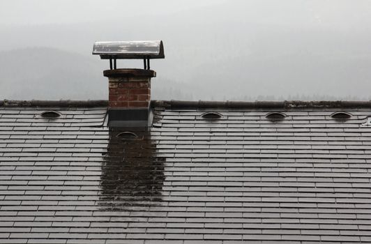 The old chimney on the top of the roof