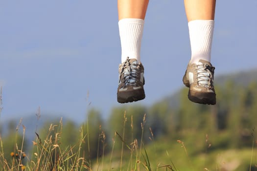 Jumping with sport shoes in summer season