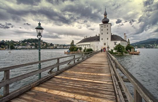 Austria : panorama of the lake and the bridge going to the church