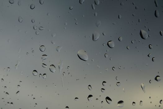 The window of the car with rain drops
