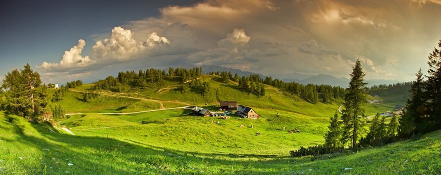 Panorama of the mountains with the sky covered by the clouds.