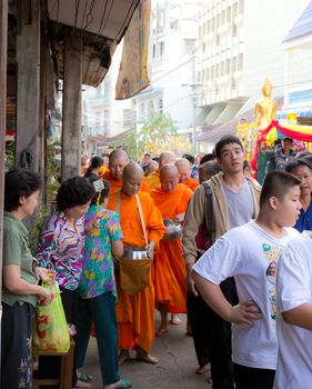 Phrae,Thailand - October 31,2012 : Unidentified Buddhist monks is given food offering from people at the morning on End of Buddhist Lent Day. on october 31, 2011 in Muang, Phrae, Thailand.