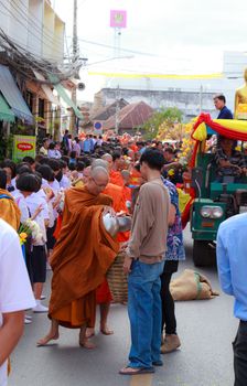 Phrae,Thailand - October 31,2012 : Unidentified Buddhist monks is given food offering from people at the morning on End of Buddhist Lent Day. on october 31, 2011 in Muang, Phrae, Thailand.