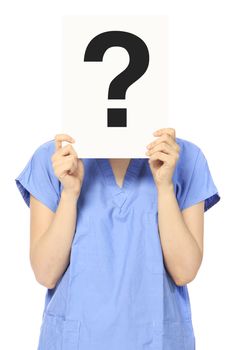 A woman in medical scrubs holding a signboard with a question mark