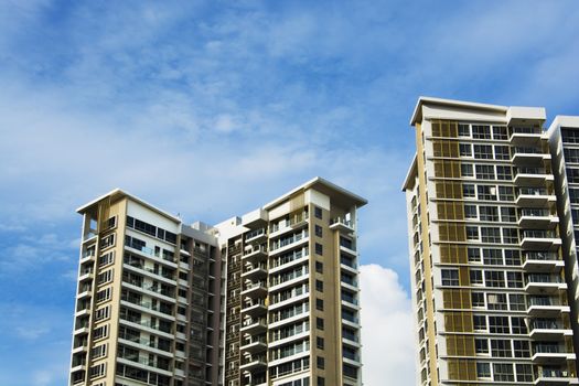 high rise apartments with sky background