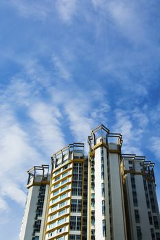 high rise apartments with sky background