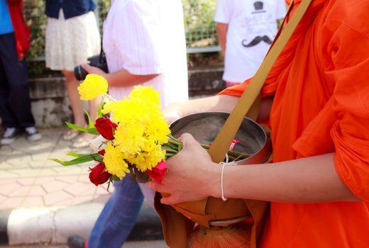 Phrae,Thailand - October 31,2012 : Unidentified Buddhist monks is given food offering from people at the morning on End of Buddhist Lent Day. on october 31, 2011 in Muang, Phrae, Thailand.