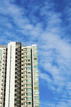 high rise apartments with sky background