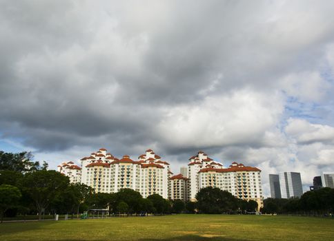 high rise apartments with sky background