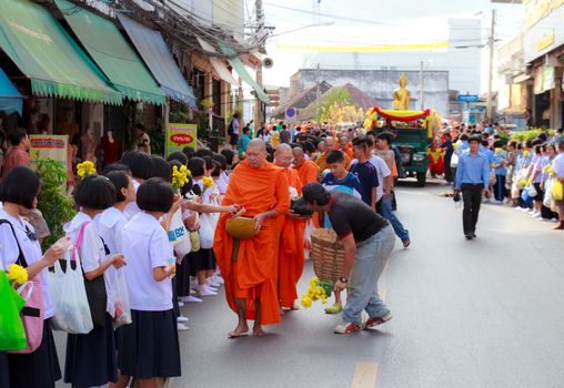 Phrae,Thailand - October 31,2012 : Unidentified Buddhist monks is given food offering from people at the morning on End of Buddhist Lent Day. on october 31, 2011 in Muang, Phrae, Thailand.