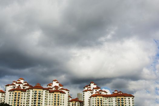 high rise apartments with sky background
