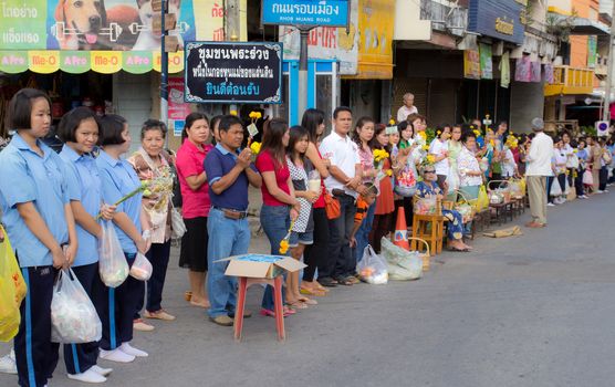 Phrae,Thailand - October 31,2012 : Unidentified Buddhist monks is given food offering from people at the morning on End of Buddhist Lent Day. on october 31, 2011 in Muang, Phrae, Thailand.