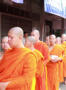 Phrae,Thailand - October 31,2012 : Unidentified Buddhist monks is given food offering from people at the morning on End of Buddhist Lent Day. on october 31, 2011 in Muang, Phrae, Thailand.