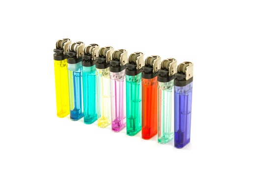 Uesd Colorful cigarette lighters in row isolate on a white background.