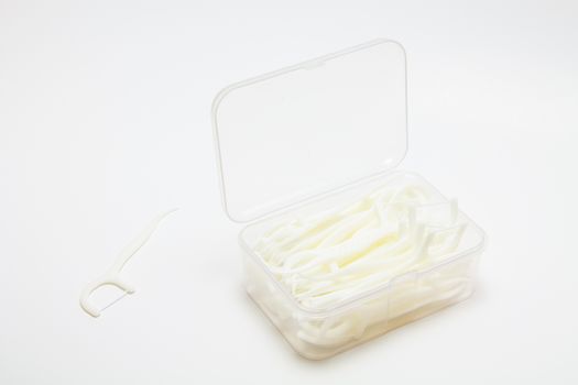 Dental flossers Toothpick with dental floss on white