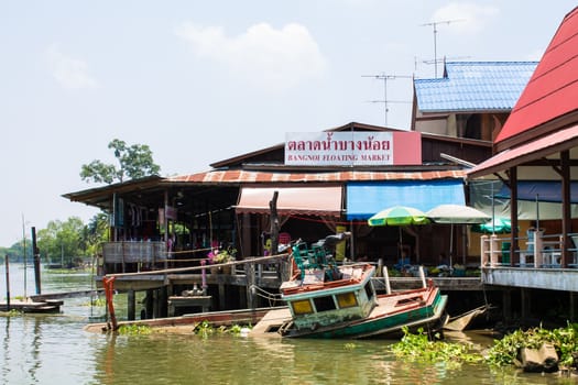 Boat capsized view on bangnoi floating market early in the morning  in Thailand on 20 April 2013