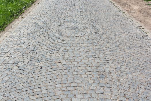 Vintage Road made of  stone cubes, horizontal shot