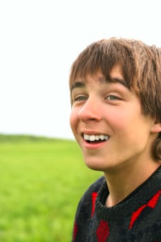 happy teenager stand in the summer fields