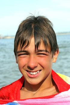 smiling teenager stand on the beach