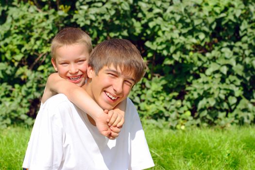 happy teenager and kid portrait outdoor