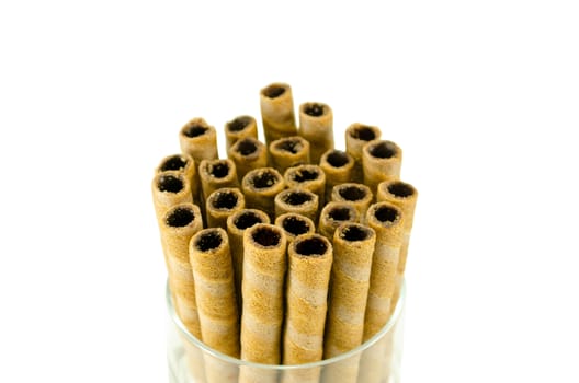 sweet tubules rolls sticks with chocolate cream inside isolated on white background.