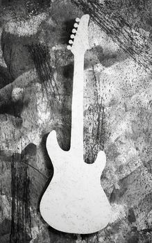 white guitar on a grey grunge background
