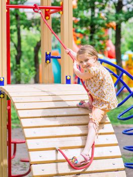 cute little girl on the playground, outdoors