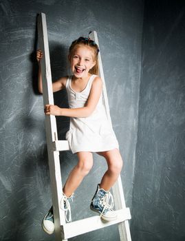 little girl on the white stairs