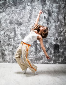 dancind girl on a gray grunge background