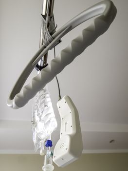 handle of a hospital bed with SOS telephone and infusion