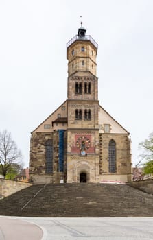 Medieval church of St Michael in the town square of Schwabisch Hall in Germany with rows of steps leading to the cathedral entrance