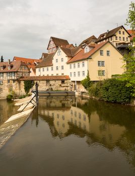 View of the old town of Schwabisch Hall inside city walls and with the RIver Kocher running alongside the buildings.