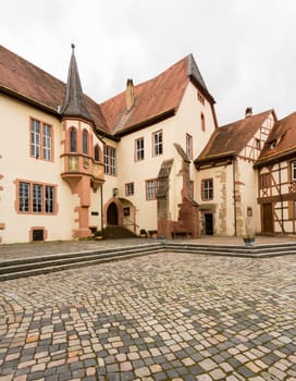 Kurmainz Castle with Turmersturm tower and Tauber Franconian Museum of Rural life in ancient town of Tauberbischofsheim in Germany