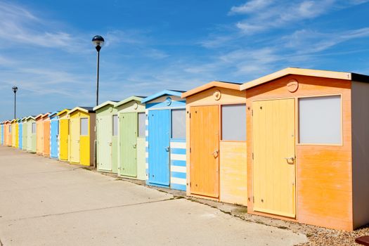 Colourful beach cabins in England