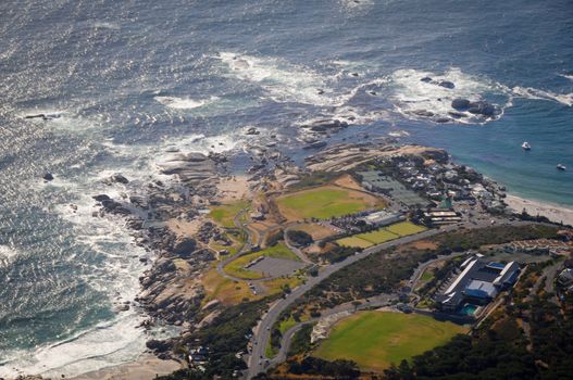 Aerial view from high mountain on ocean coastline with roads, parkings and buildings, Cape Town, Soth Africa