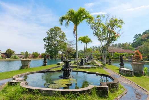 Green tropical park with fountains and ponds, Tirtaganga, Bali