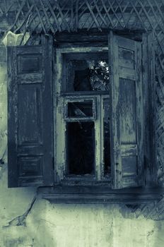 Old abandoned haunted house wooden window with shutters