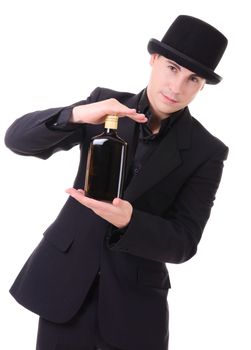 Handsome fashionable man in retro style with bottle of alcohol drink in his hand isolated on white background