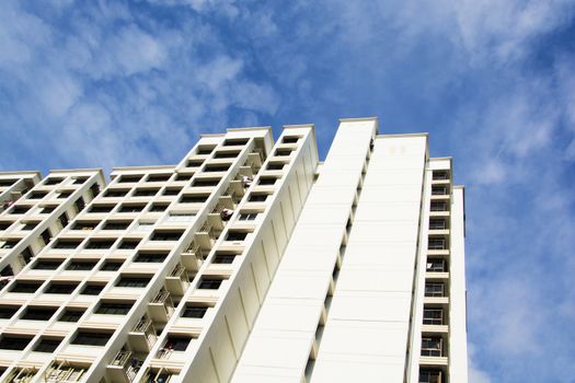 high rise apartments with sky background