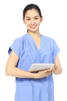 A woman in medical attire holding a tablet computer