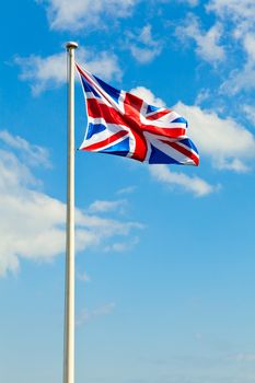 National flag of the United Kingdom against blue sky