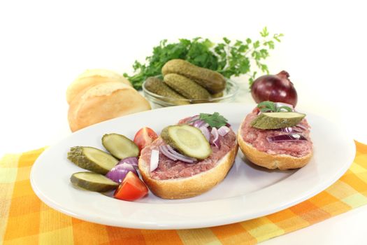delicious white bread with pickles on a light background