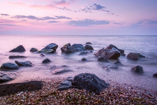 Beautiful seascape with orange warm sunrise, vacation concept