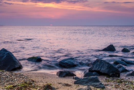 Beautiful seascape with orange warm sunrise, vacation concept