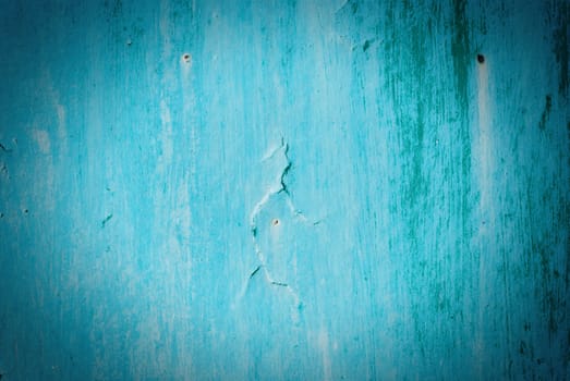 Old cracked painted texture. Rusty blue wood. Grunge background.