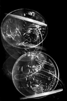 Stroboscopic effect created using flash capturing the motion of a coin as it is spinning