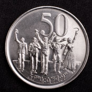 Figures of workers on the face of the Ethiopian fifty cents coin