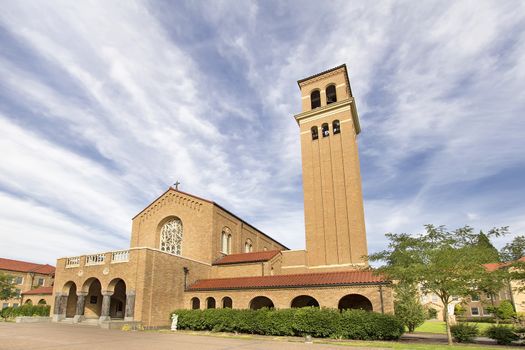 Mount Angel Abbey Catholic Church in St Benedict Oregon Against Blue Sky and Clouds